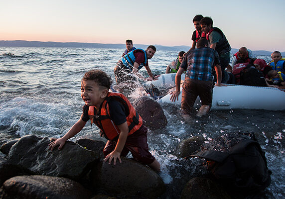 A group of Syrian refugees arrive on the island of Lesbos after traveling in an inflatable raft from Turkey, near Skala Sykaminias, Greece.